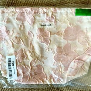 New zip bag/makeup bag. New in packaging.  6x8 .